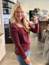 Load image into Gallery viewer, blonde wearing maroon long sleeve shirt