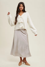 Load image into Gallery viewer, Girl wearing off white bow sweater
