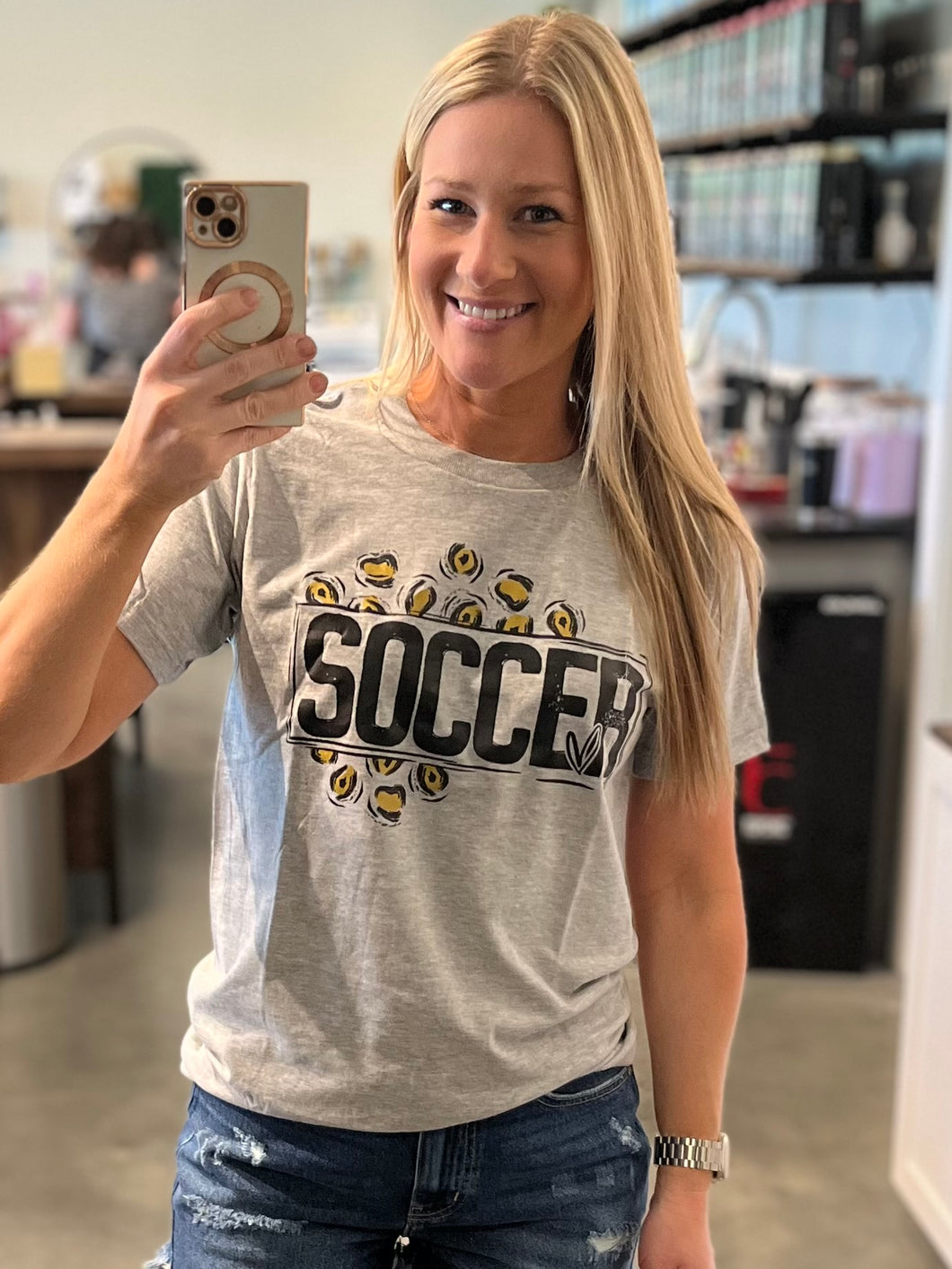 Soccer mom with leopard ￼graphic tee