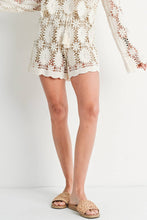 Load image into Gallery viewer, model wearing crochet shorts and sandals
