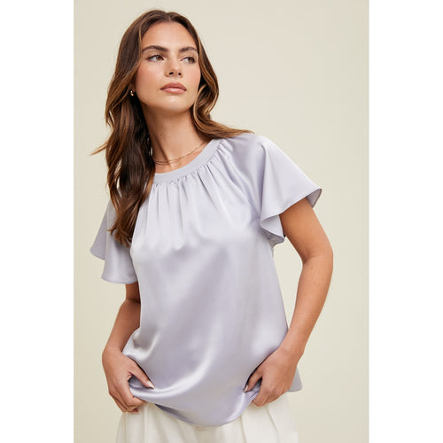 girl wearing satin blouse