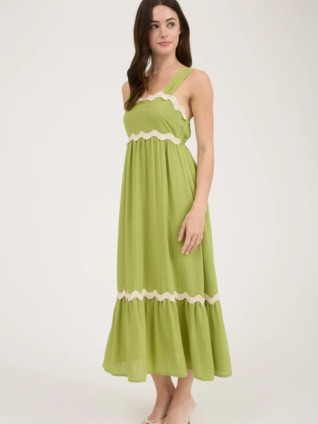 brunett woman wearing green maxi dress