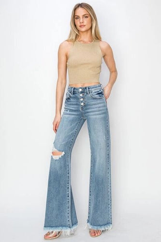 girl wearing wide leg fray hem jeans