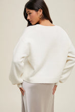 Load image into Gallery viewer, Girl wearing off white bow sweater facing backwards 
